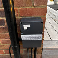 A new consumer unit by Fusebox located outside with its IP65 rating supplying new garden circuits in Bookham.