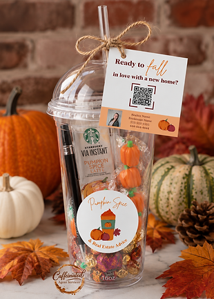 Eye-level view of a disposable iced coffee cup decorated with pumpkin-themed stickers and tied with a tag featuring a QR code