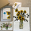 Thumbnail: Photo shows what's in this boxed gift set: Sunflower illustrations on a tea towel, a notepad, and a gift enclosure card