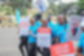 A smiling group of people participating in the Mental Walk