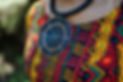 A close up of colourful fabric and jewellery