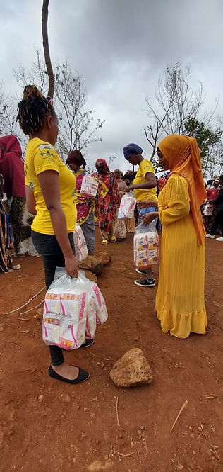 People distributing menstrual products