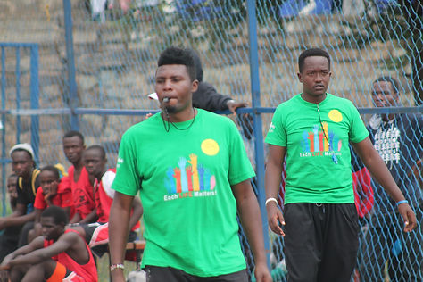 A coach blowing a whistle