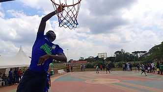 A basketball player mid jump