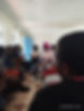 A group of people sitting down together in discussion