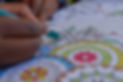A close up of a hand doing mindfulness colouring