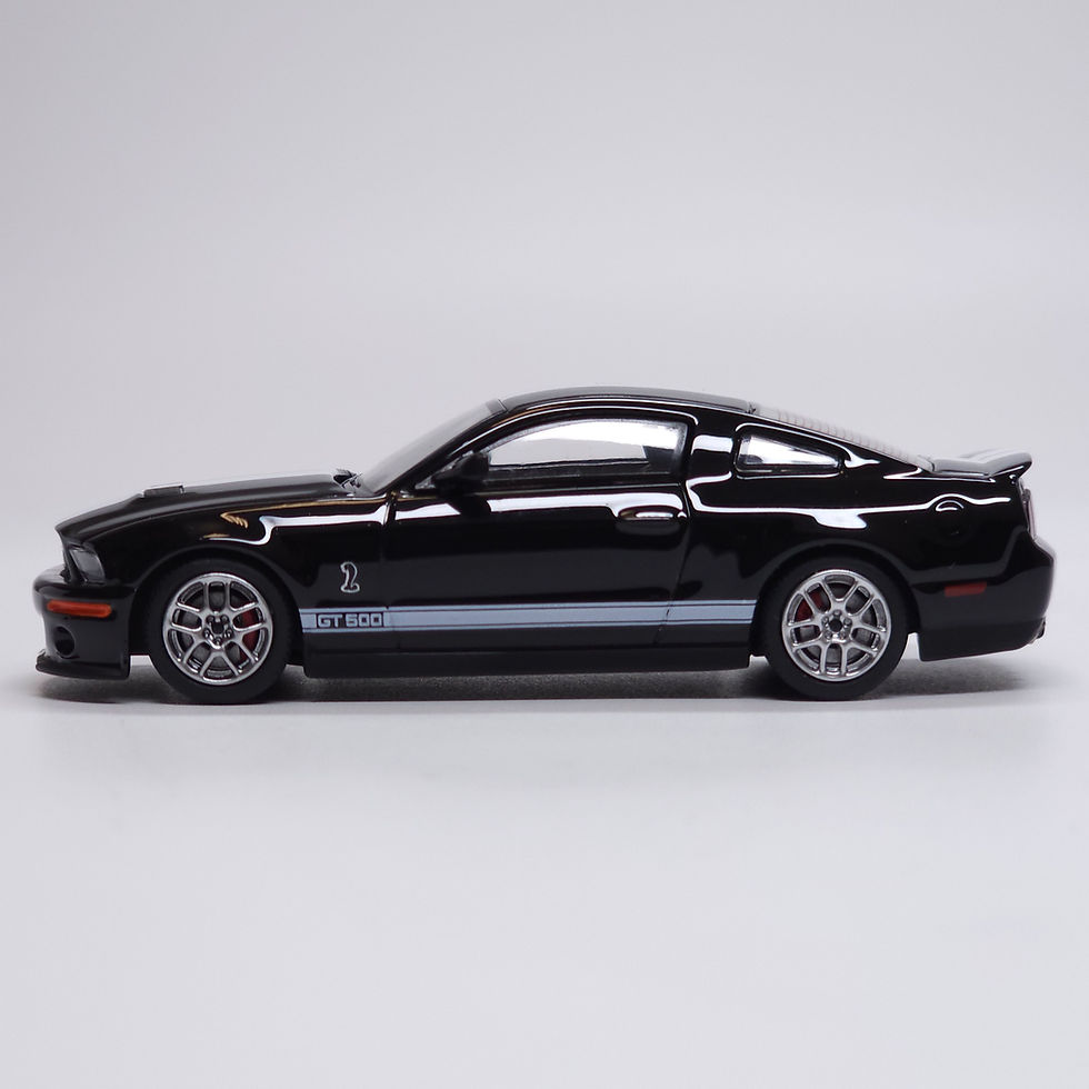 Thumbnail: Greenlight x MotorHelix 2007 Ford Mustang Shelby GT500 Black w White Stripes