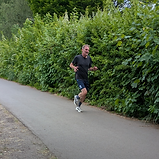 Man running on a paved path