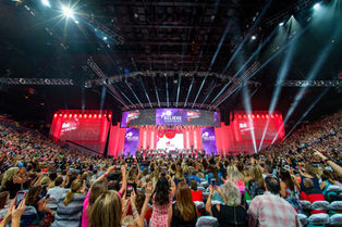 crowd at an indoor convention stadium arena