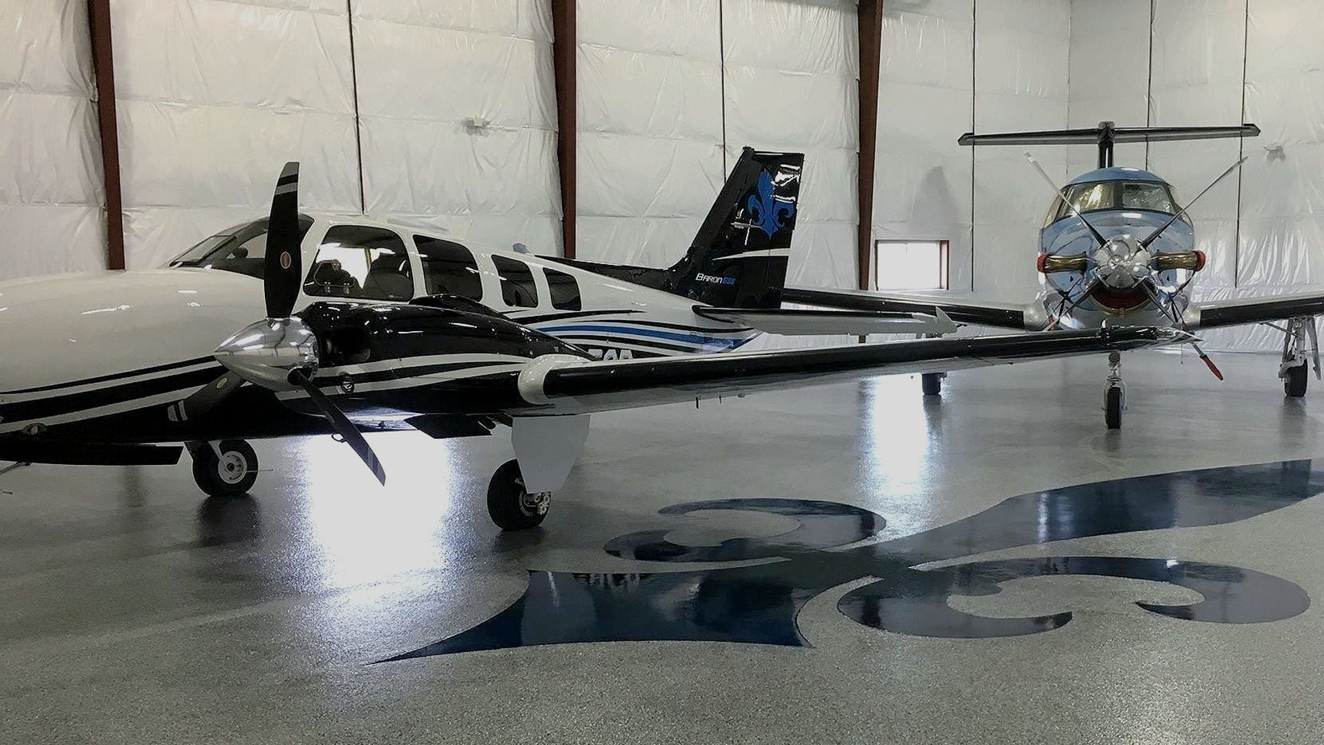 Glossy epoxy floor in an aircraft hangar