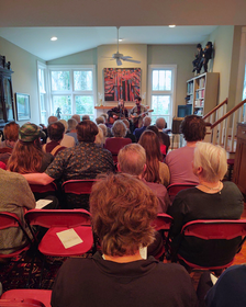 Back-row view of the concert as Viv & Riley strum their guitars.