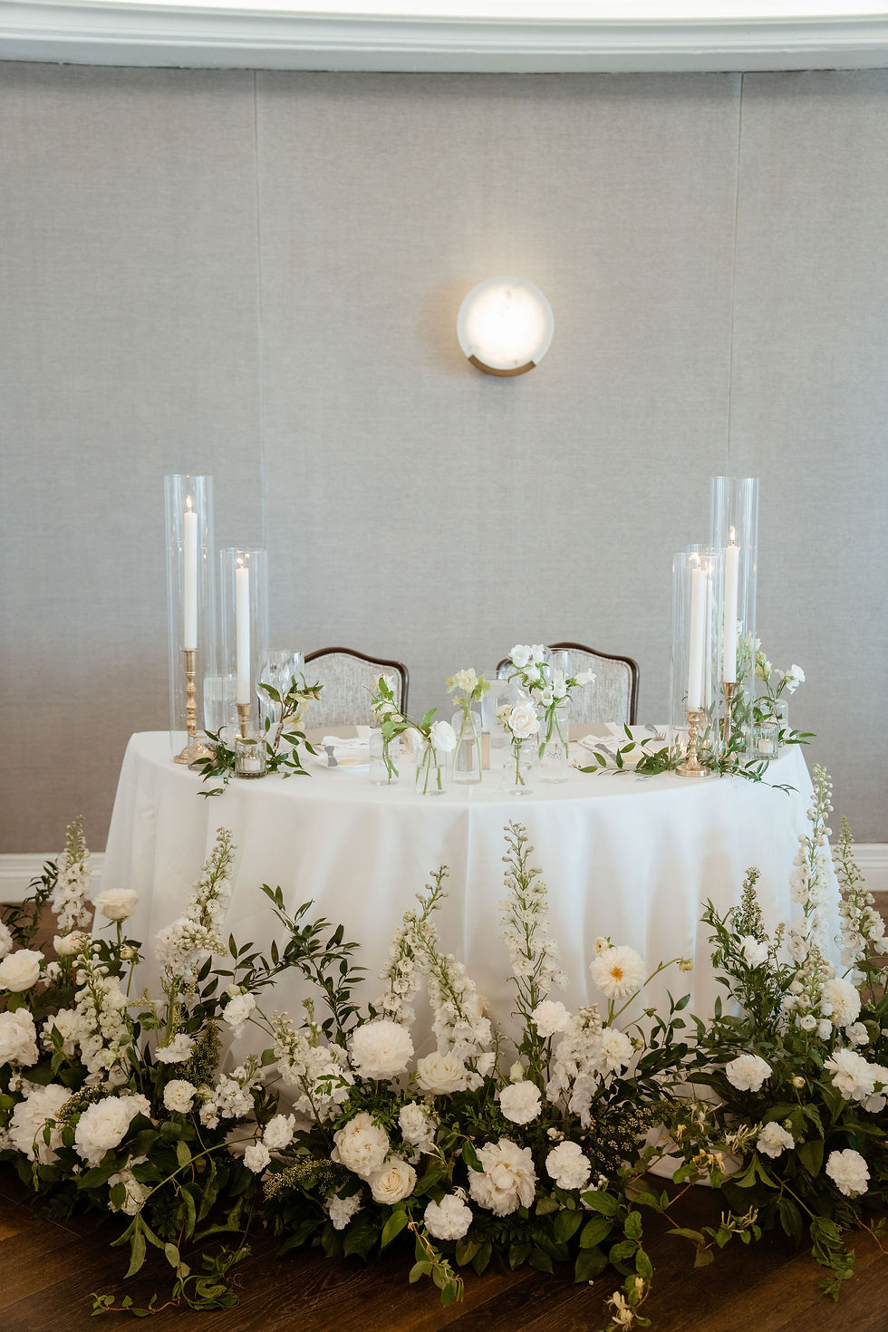 sweetheart table with white florals and greenery