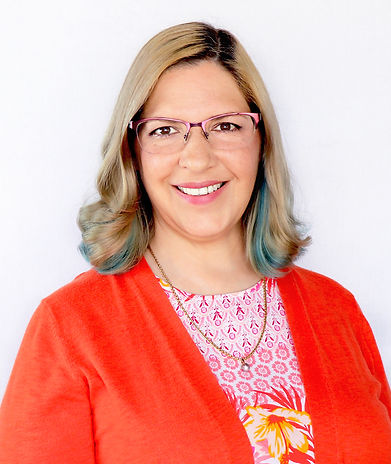 Image of Kate De Jong wearing a bright red cardigan