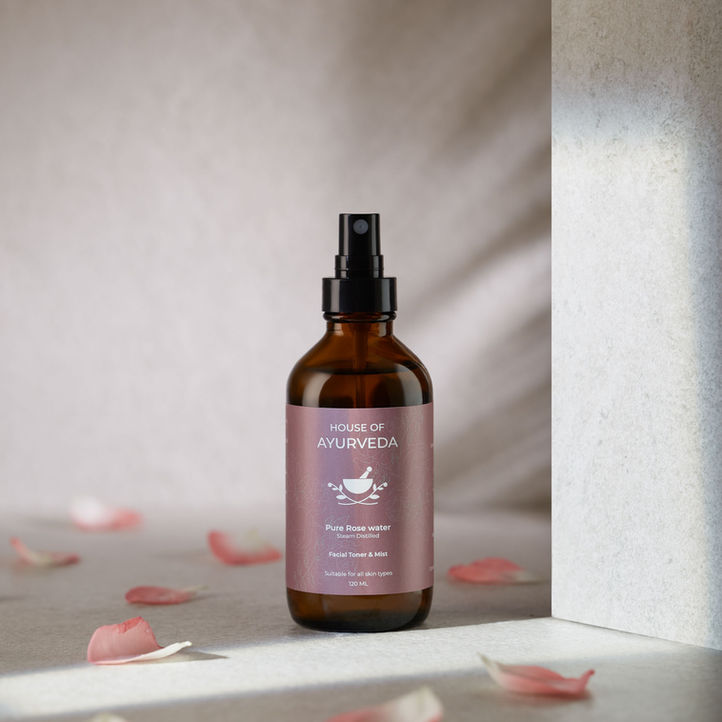 rose water facial mist product photography with natural styling for skincare brand advertising