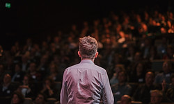 Speaker in front of a Crowd