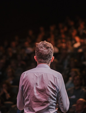Speaker in front of a Crowd