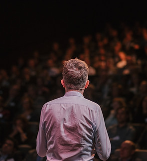 Speaker in front of a Crowd
