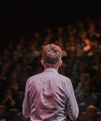 Speaker in front of a Crowd
