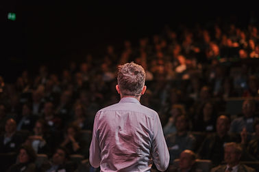 Speaker in front of a Crowd