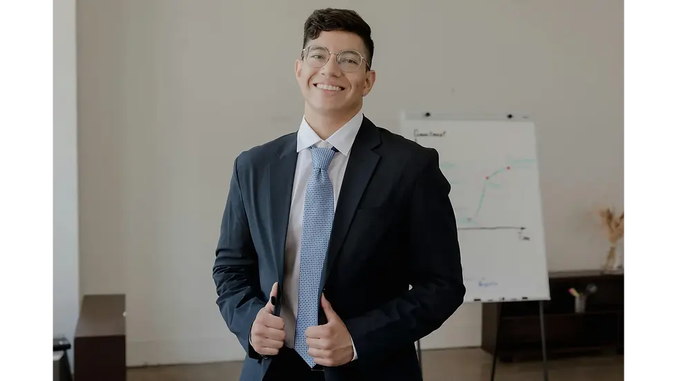 Confident young professional smiling in a suit, illustrating how to stop overthinking and project self-assurance