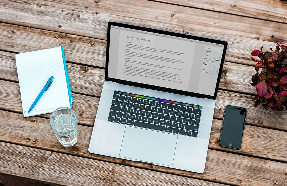 Desk with notebook and pen, ideas on how to start a book writing plan in 2026, outlining the first chapters