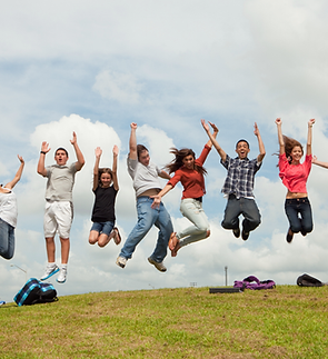 Teens jumping outdoors representing healthy, active lifestyle