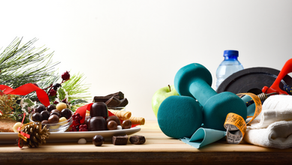 Holiday treats and decorations on left; teal dumbbells, tape measure, and water bottle on right, symbolizing balance.