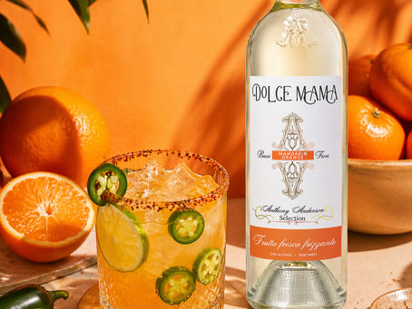 an image of a bottle of orange wine and a spicy cocktail