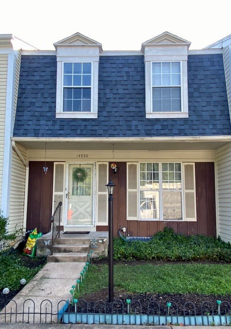 House after completed roof and vinyl siding replacement