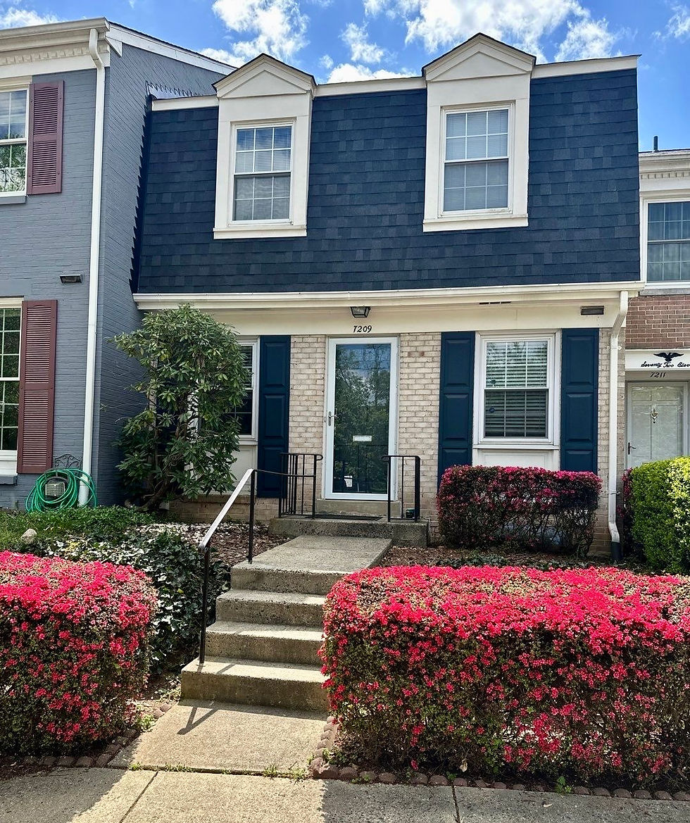 House showing finished exterior remodeling project, including new roof and new windows and doors