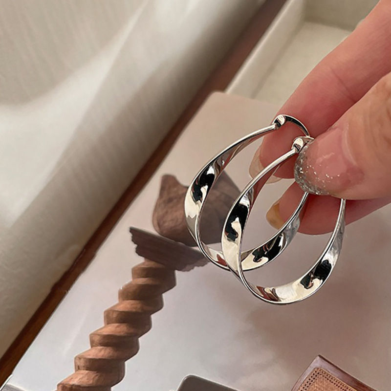 Thumbnail: Silver Geometric Twisted Hoop Earrings