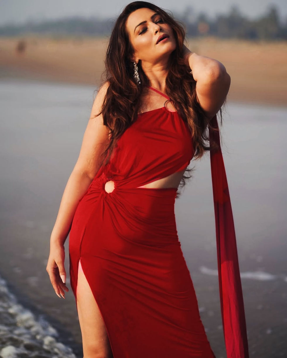 Setting the Shoreline on Fire: Samikssha Batnagar in a Fiery Red Cut-Out Gown