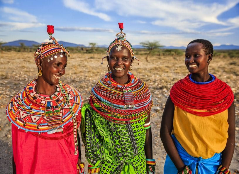 Authentic cultural encounter with Maasai women in traditional attire during an African safari experience