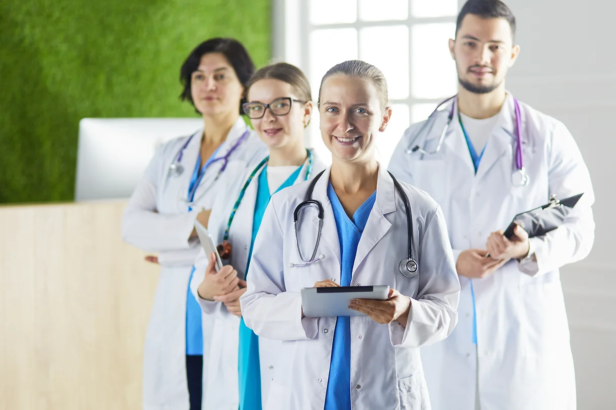 group-doctors-nurses-standing-hospital-room.webp