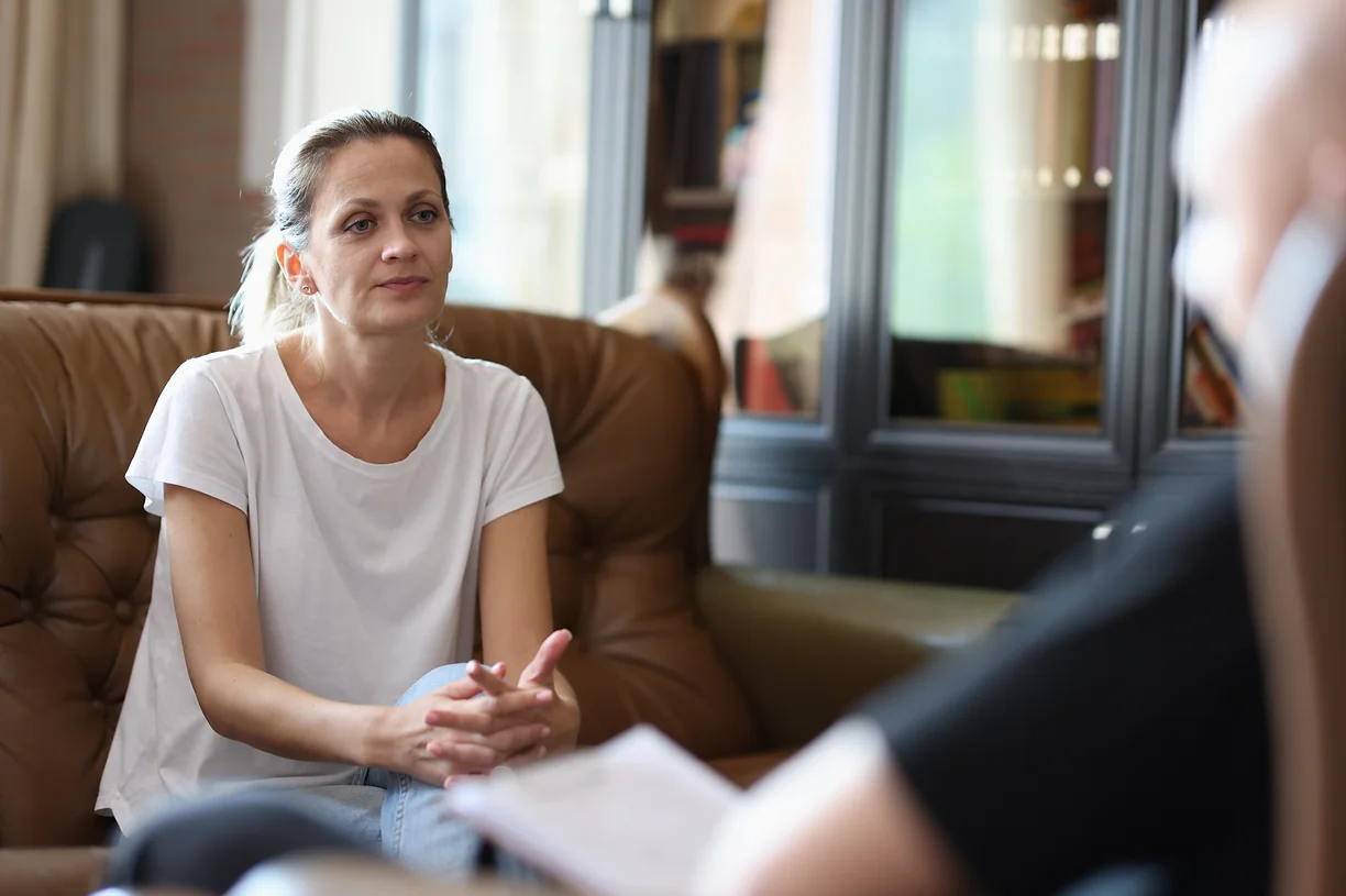 woman-with-emotional-issues-visits-psychologist-office-female-patient-listens-man-doctor_j