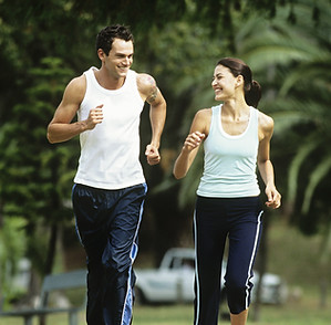 Photo of a Couple Running
