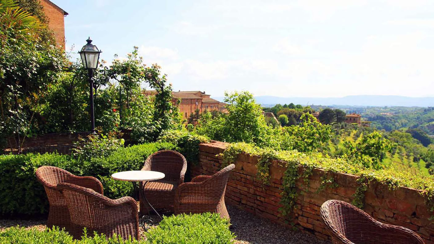 Patio with view of the Tuscan countryside in Siena
