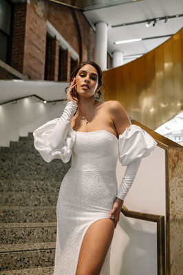 Beaded strapless wedding dress with side split and removable bridal accessory sleeves in satin.