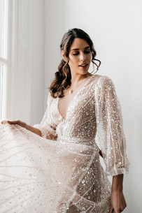 Balloon sleeve wedding dress with sparkling fabric.