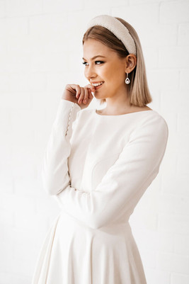 Cizzy long sleeve crepe wedding dress with low scoop back and full a-line skirt.