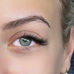 Eye with full eyelashes and defined eyebrow shapping in wimbledon