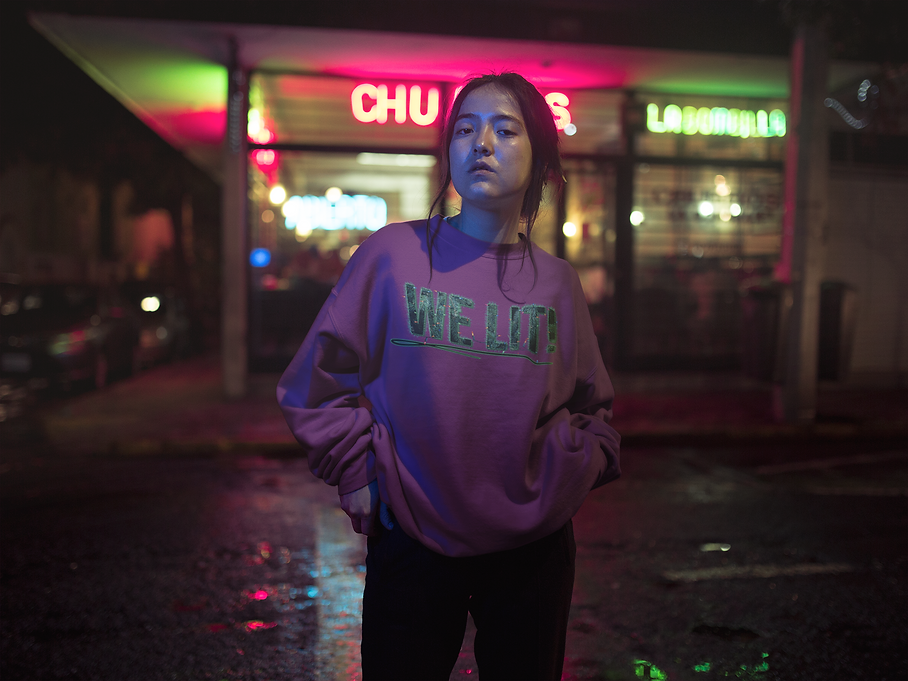 crewneck-sweatshirt-mockup-of-a-young-asian-girl-in-front-of-neon-street-lights-a12713.png