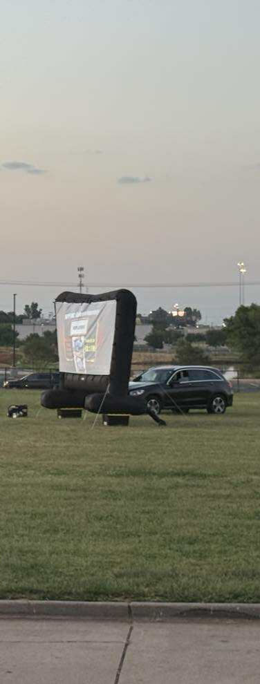 Students and families enjoying movie night at school