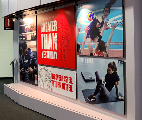 A full wall of branded graphics in a retail space