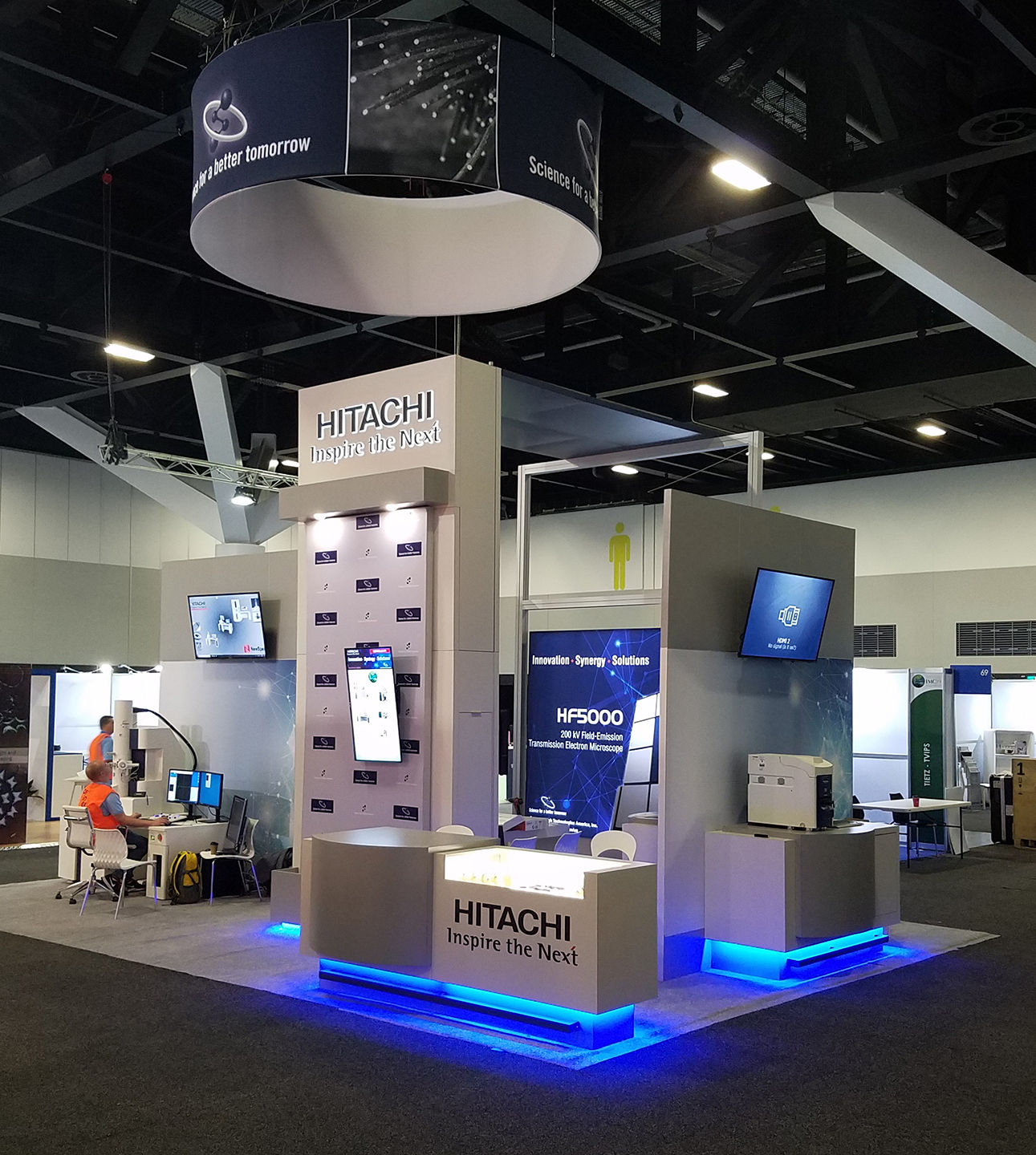 A trade show booth for a technology company and their microscope division. The booth features LED lighting, custom millwork, and printed graphics.