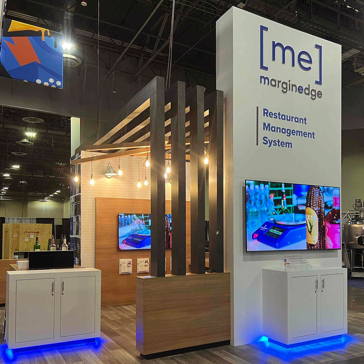 Trade show booth for a food management company with modern design, monitors, LED lighting and installation