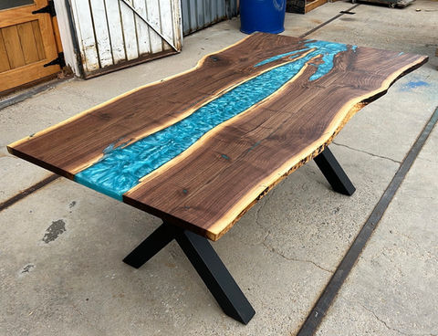 Custom epoxy river table with blue epoxy, natural edges and steel legs by Narrow Leaf Woodworks in Albuquerque 