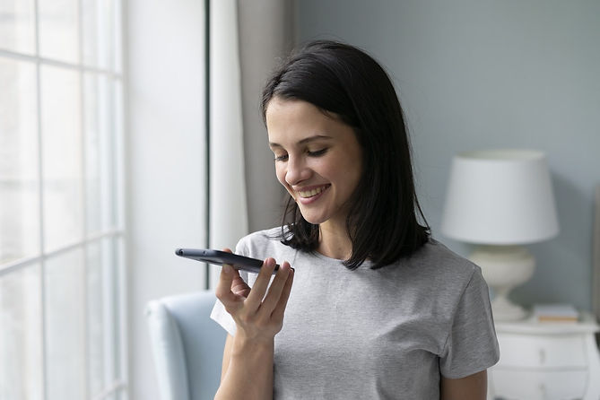 young-woman-holding-her-phone-min.jpg