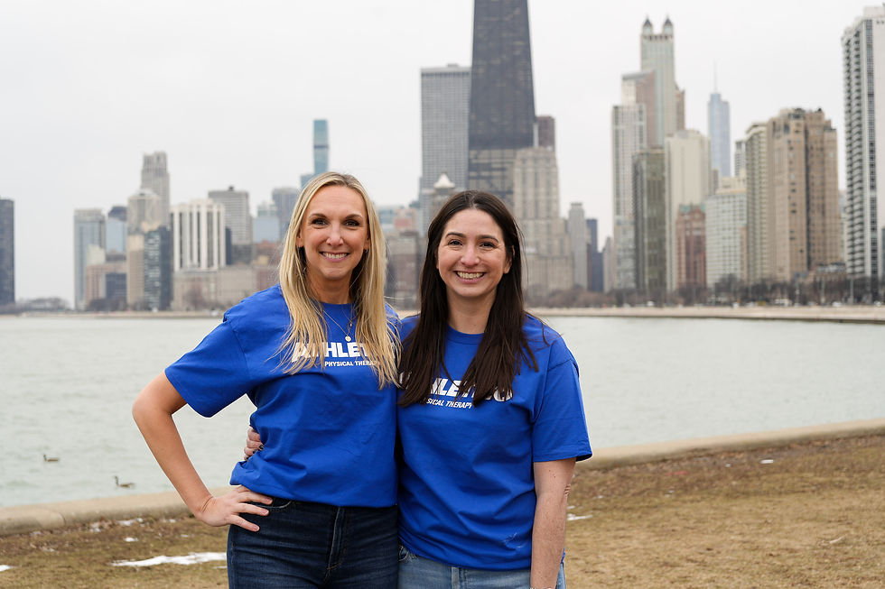 Lucie and Erin at the lake front with Athletico tshirts on.