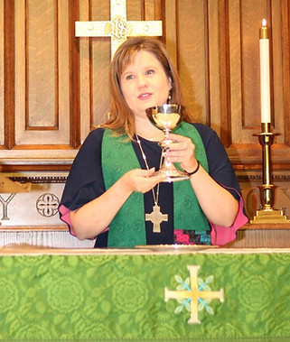 Pastor Sami leads worship. We participate in Holy Communion every week.